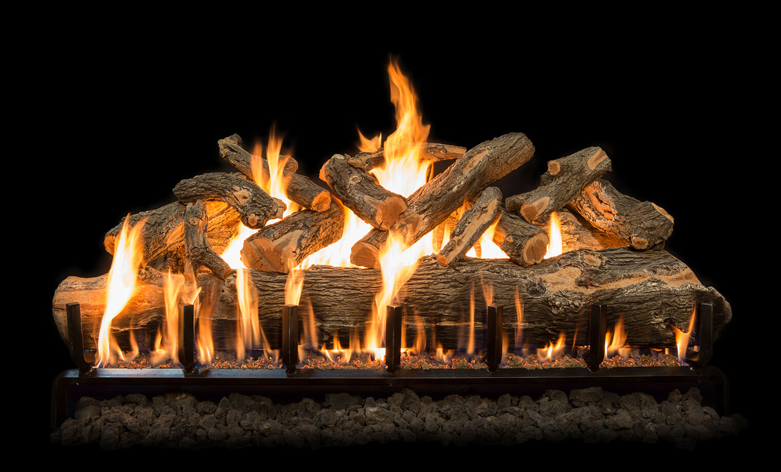 A large gas log set with rustic, brown bark detailing and robust, orange flames.